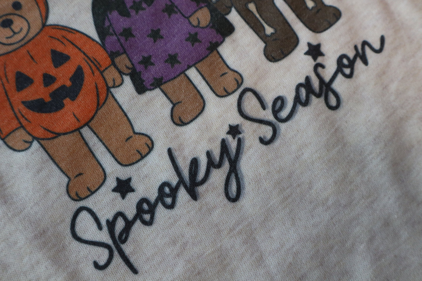 Halloween-themed fabric with teddy bears in costumes and 'Spooky Season' text.