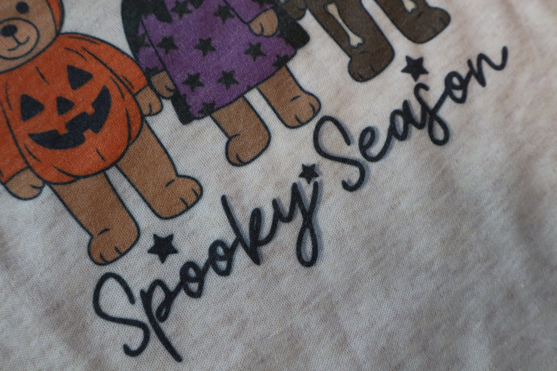 Halloween-themed fabric with teddy bears in costumes and 'Spooky Season' text.