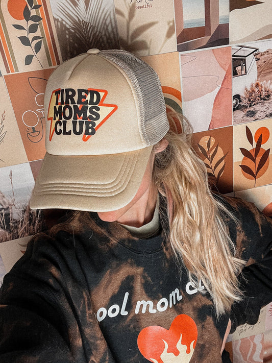Trendy aesthetic tired moms club hat,trendy gift for mom, first time mom baby shower or Christmas gift. Tan trucker hat with tired mom club logo
