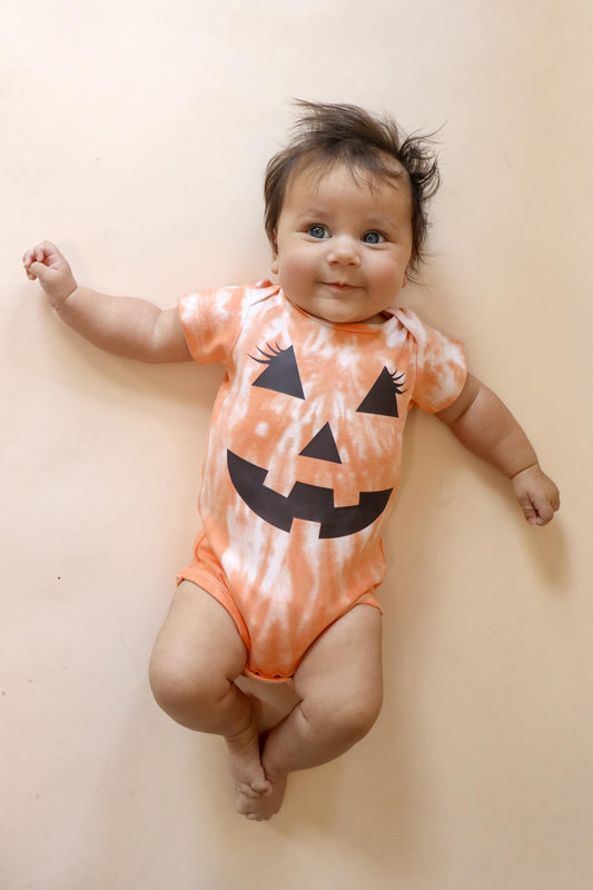 Infant and toddler Halloween tie-dye shirts with black jack-o-lantern faces