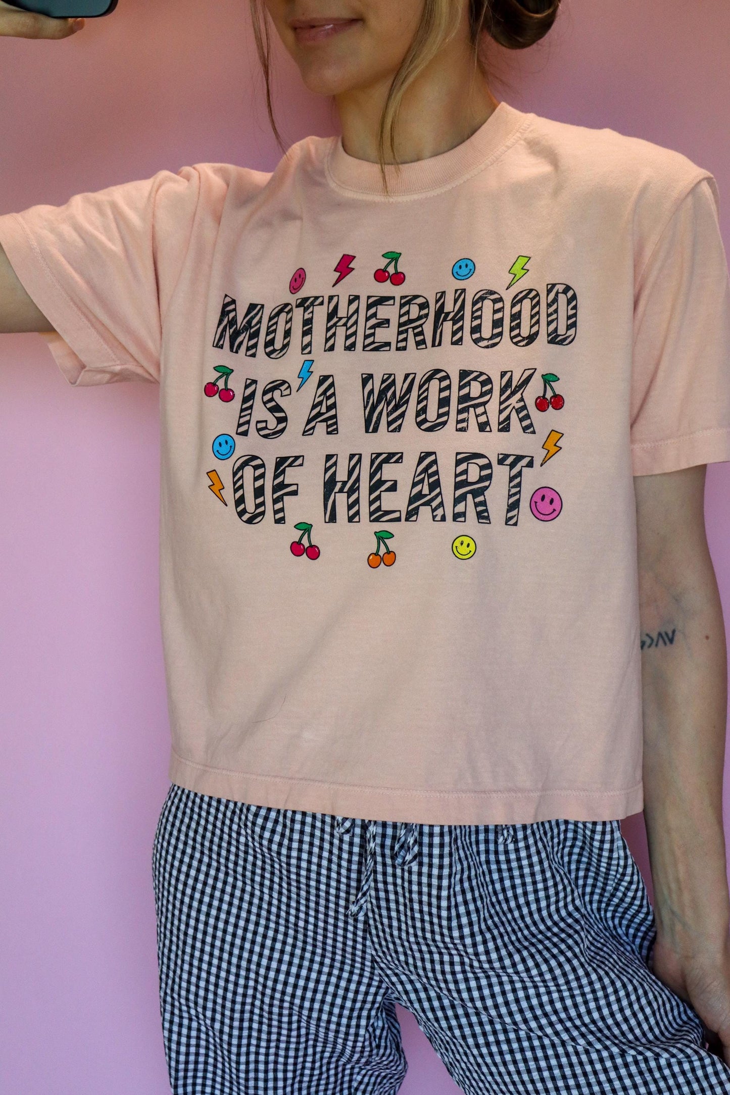Motherhood Is a Work of Heart Shirt, Trendy Mom Tee, Cute Graphic Mom Shirt, Cherry Happy Face Shirt, Comfort Colors® Peach Tee