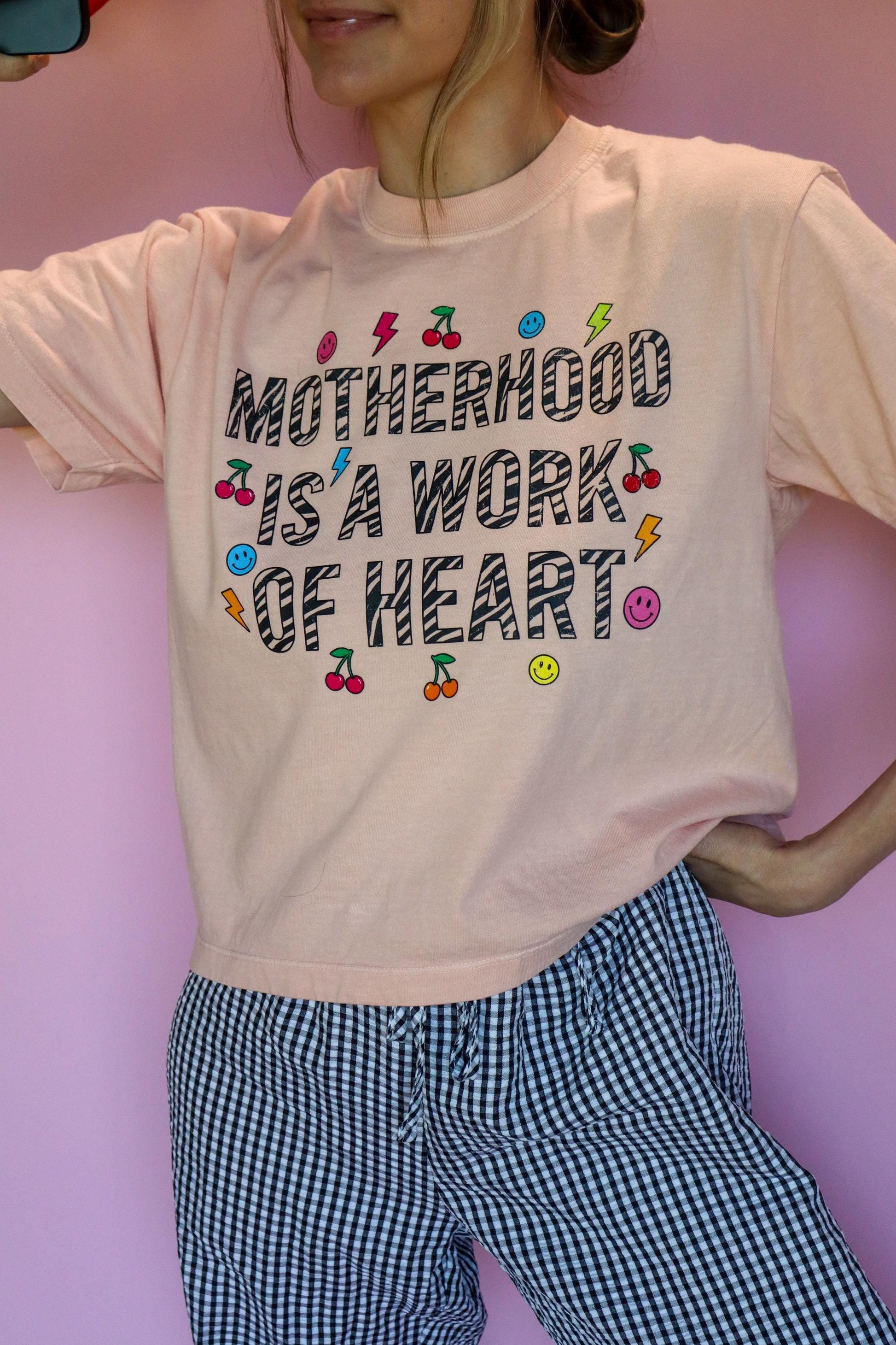 Motherhood Is a Work of Heart Shirt, Trendy Mom Tee, Cute Graphic Mom Shirt, Cherry Happy Face Shirt, Comfort Colors® Peach Tee