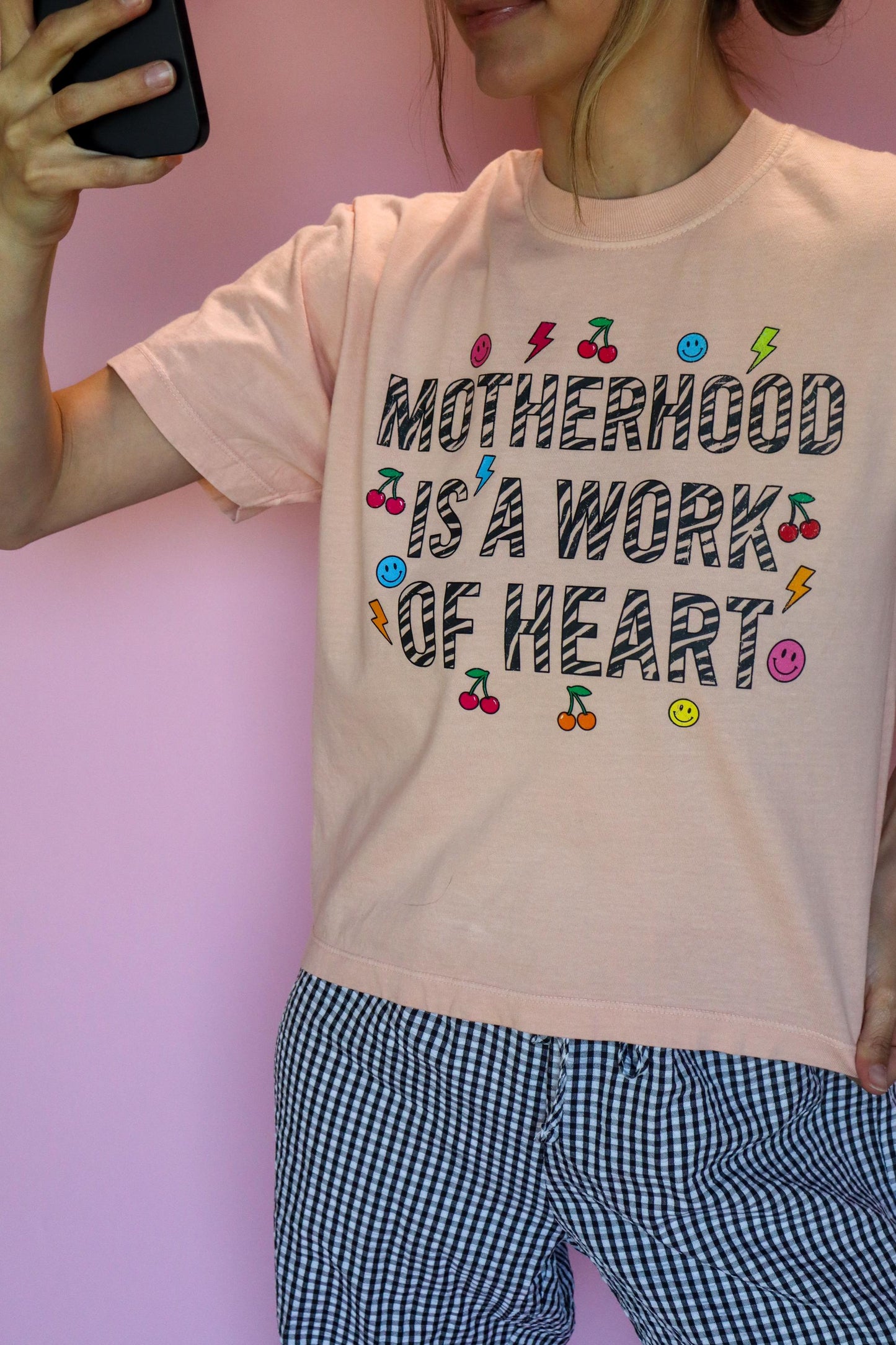 Motherhood Is a Work of Heart Shirt, Trendy Mom Tee, Cute Graphic Mom Shirt, Cherry Happy Face Shirt, Comfort Colors® Peach Tee